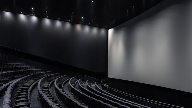 Black cinema white wide screen and auditorium seats 
