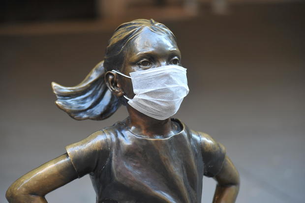 The 'Fearless Girl' statue stands across from the New York 