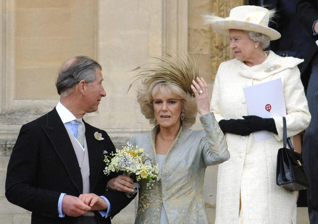 Britain's Prince Charles (L) looks at hi 