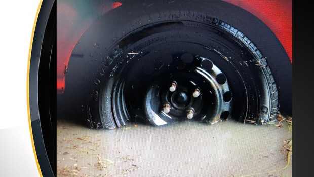 north-side-flash-flooding-car-stuck-tire 