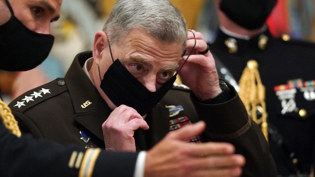 Milley puts his mask back on after U.S. President Donald Trump presented the Medal of Honor in Washington 