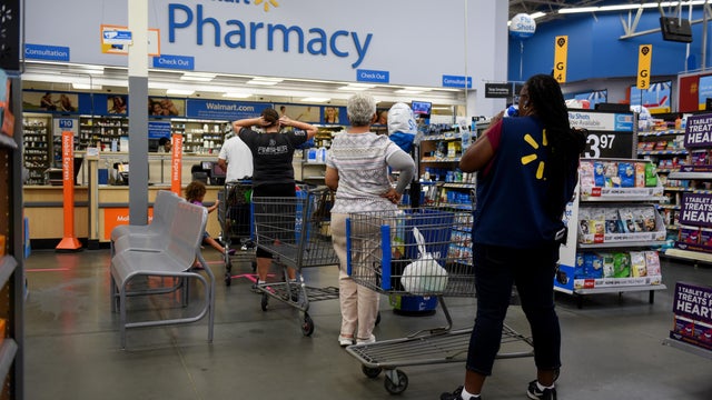 Shoppers wait at Walmart pharmacy