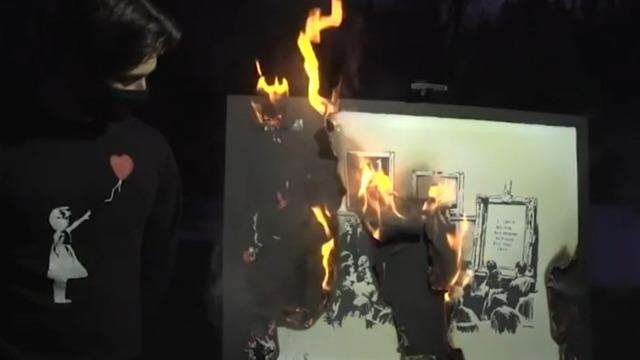 cbsn-fusion-crypto-enthusiasts-burn-and-digitize-banksy-artwork-dan-patterson-2021-03-04-thumbnail-661127-640x360.jpg 