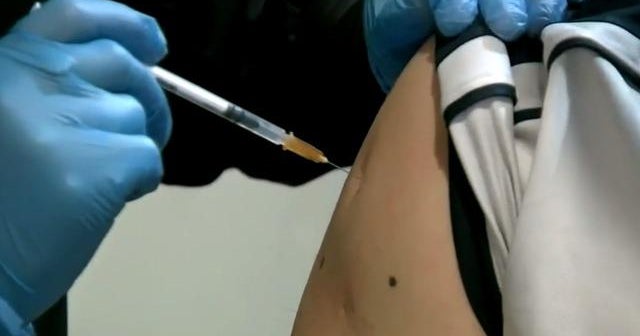 Americans see COVID progress but vaccine lags continue