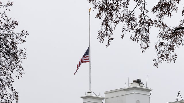 The U.S. flag atop the White House is lowered to half-staff in honor of the Georgia day spas attacks victims in Washington 