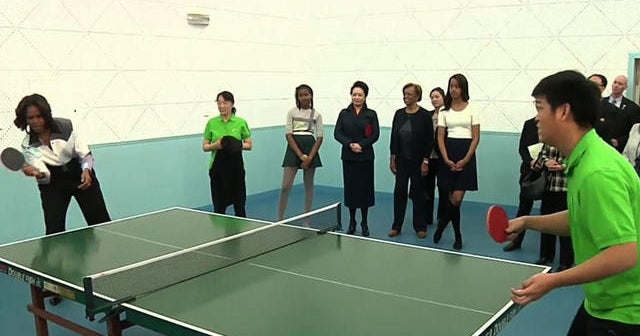 First lady Michelle Obama visits high school in China, plays ping pong