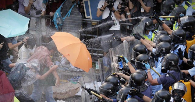 Pro-democracy protestors in Hong Kong defy calls to disperse