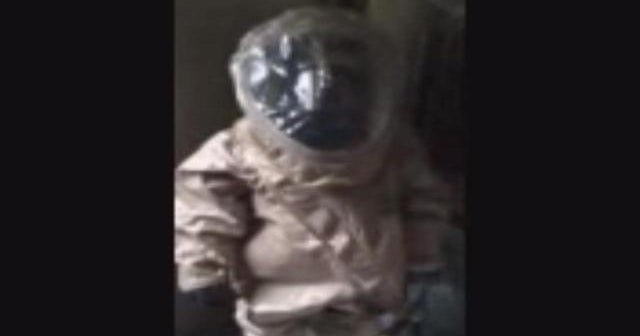 Hazmat workers inspect the home of NYC Ebola patient