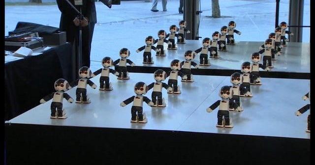 Watch 100 mini robots perform a synchronized dance