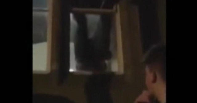 British burglar dangles from window