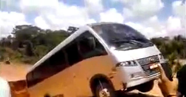 Watch as a bus gets swallowed by a crater