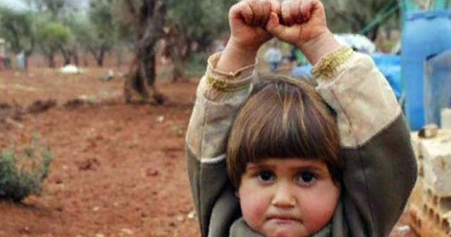 Photo of child surrendering to camera goes viral