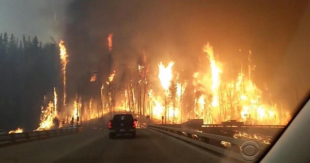 5/5: Wildfire drives massive evacuation in Alberta, Canada; Brothers prepare to reach for Kentucky Derby history