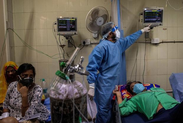 FILE PHOTO: Patients suffering from the coronavirus disease (COVID-19) get treatment at the casualty ward in Lok Nayak Jai Prakash (LNJP) hospital, amidst the spread of the disease in New Delhi 