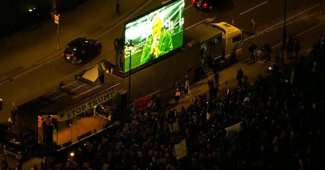 Anti-Trump protesters gather outside Parliament