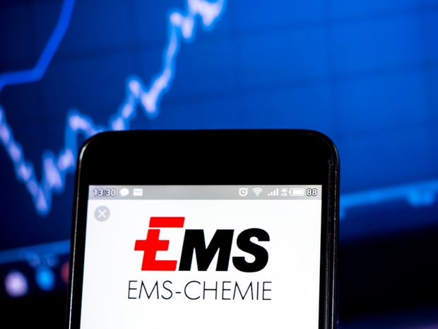 In this photo illustration a Ems-Chemie Holding logo seen