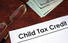 Child tax credit written on a paper. Financial concept. 