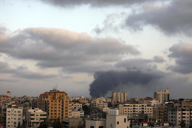 Smoke billows from a building targeted during an Israeli airstrike in Gaza City May 20, 2021. MAJDI FATHI/NURPHOTO VIA AP