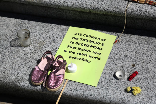 215 pairs of children's shoes set up in Vancouver as tribute after residential school discovery 