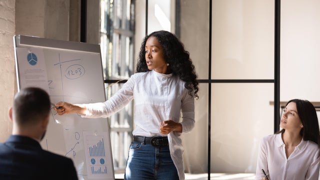 woman giving a presentation at work