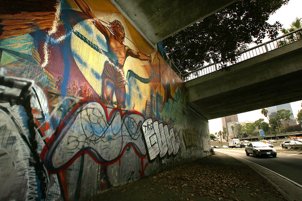 Judy Baca's "Hitting the Wall" Olympic women's marathon runner mural under fourth street bridge on 