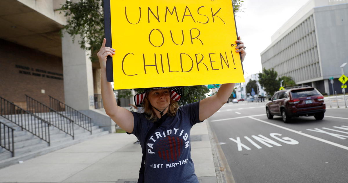 Pressure increases on school districts defying states' mask mandate bans