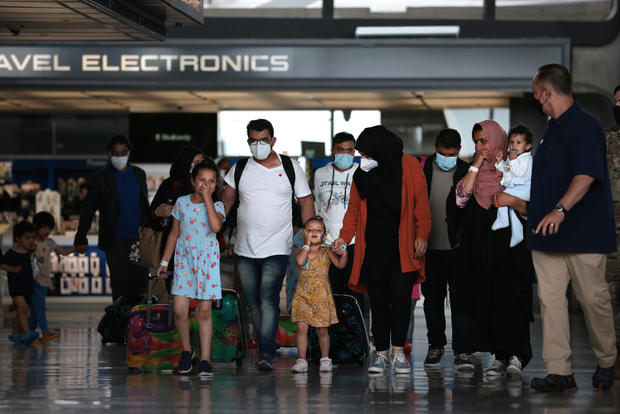 Afghan Refugees Arrive At Dulles Airport After US Pulls Out Final Troops 