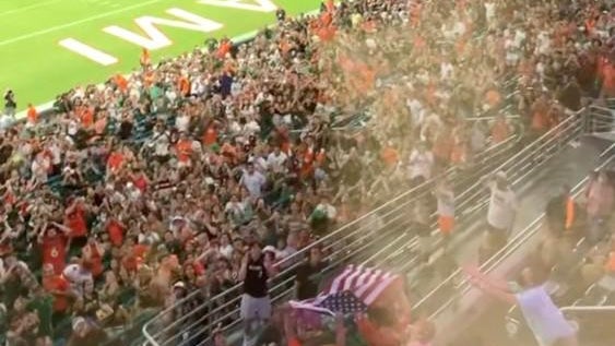 miami-hurricanes-fans-use-american-flag-as-net-to-help-save-falling-cat-at-hard-rock-stadium-091121.jpg 