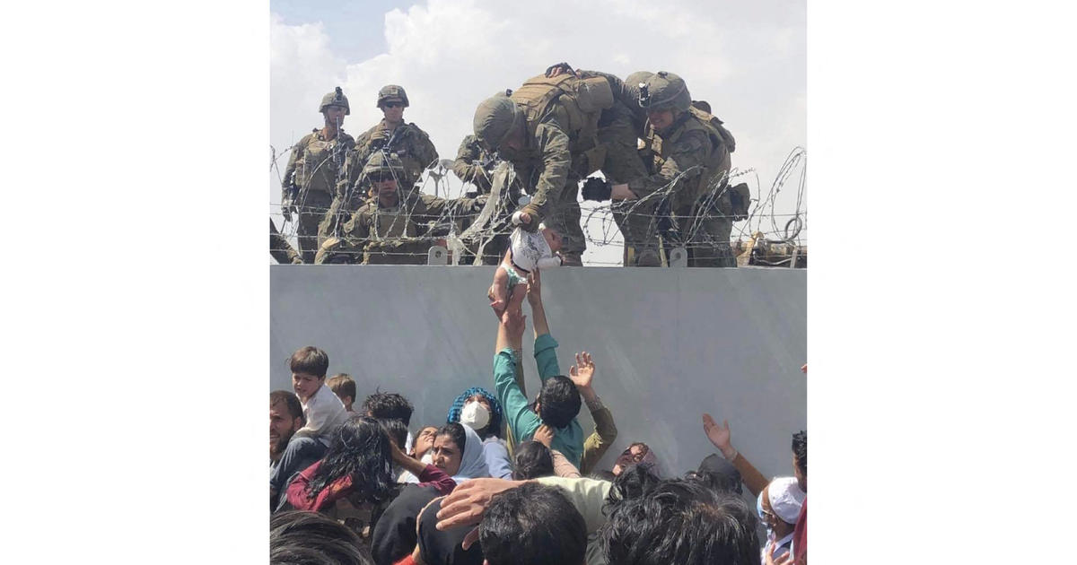 An Afghan baby was lifted to safety by a U.S. Marine in Kabul. Here's what happened to her