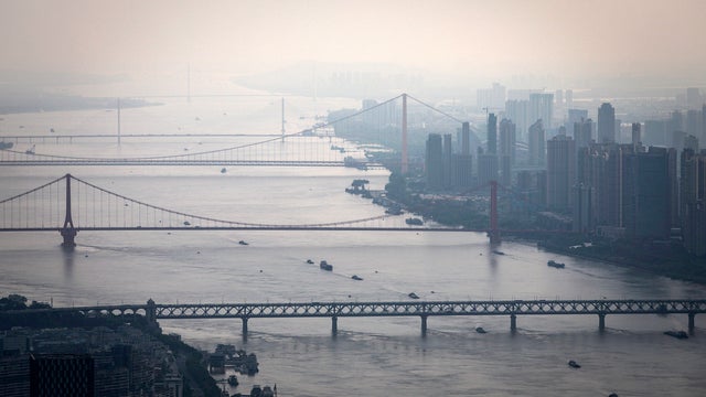 Bridges over the Yangtze River are seen from the Wuhan Greenland center during its construction August 11, 2020, in Wuhan, China.