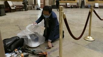 Signs, torn press vest among January 6 artifacts collected for exhibit 