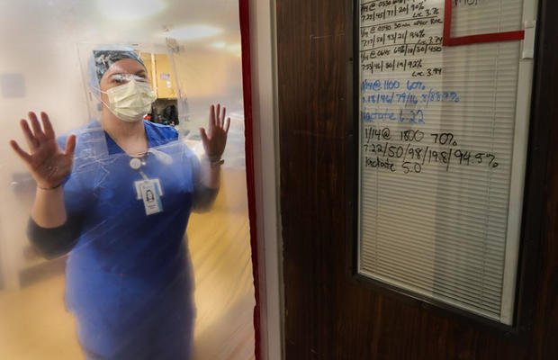 nurse-looking-through-glass.jpg 