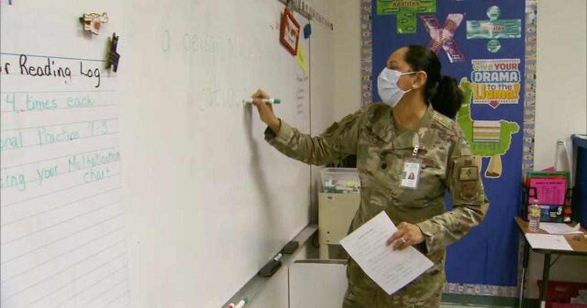New Mexico governor and National Guard troops volunteer to substitute teach amid state's COVID surge: "Neighbors helping neighbors"