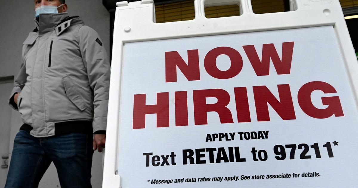 Job market still chugging even as economic risks grow
