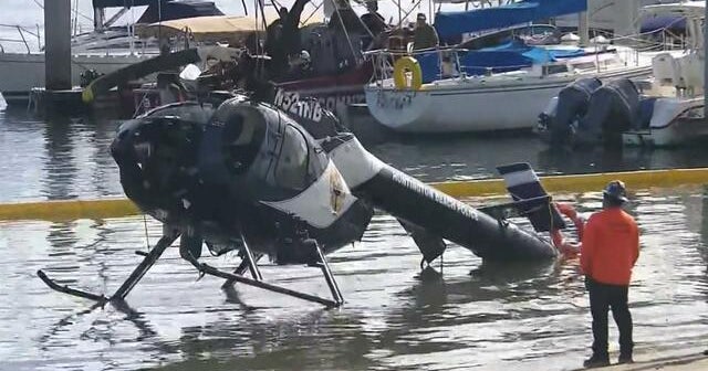 One police officer is dead after two helicopters crash near beaches in