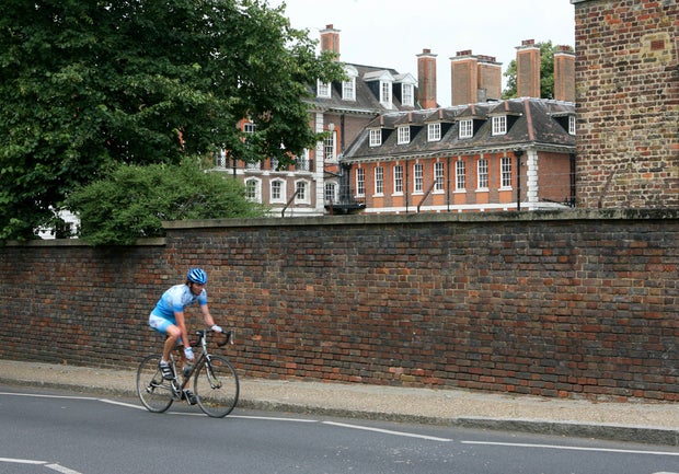 A cyclist rides past Witanhurst House in London, U.K., Thurs 