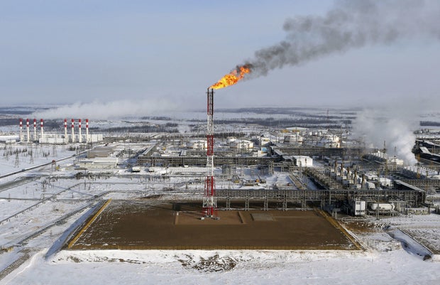 FILE PHOTO: A flame burns from a tower at Vankorskoye oil field owned by Rosneft company north of the Russian Siberian city of Krasnoyarsk