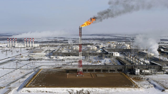 FILE PHOTO: A flame burns from a tower at Vankorskoye oil field owned by Rosneft company north of the Russian Siberian city of Krasnoyarsk 