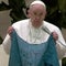 Pope Francis holds up and kisses Ukrainian flag from Bucha