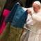 Pope Francis kisses a Ukrainian flag, denounces massacre in Bucha