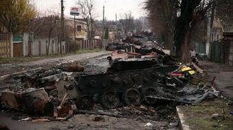 Cleanup crews dig through rubble near Kyiv 