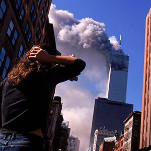 Shocked New Yorker Watches the World Trade Center on September 11, 2001 