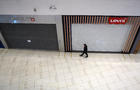 Man walking through empty mall 