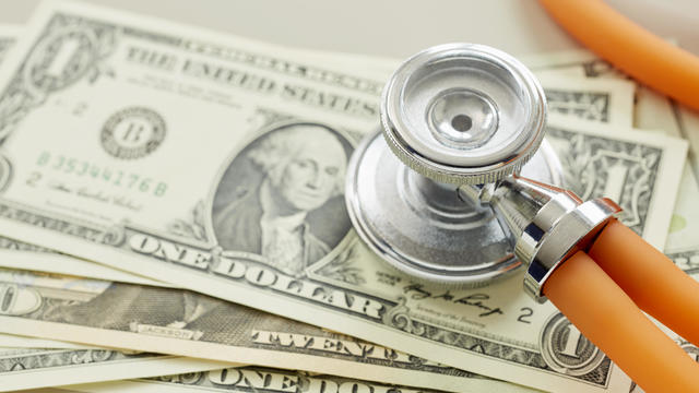 Close-up of American Dollar banknotes with stethoscope 